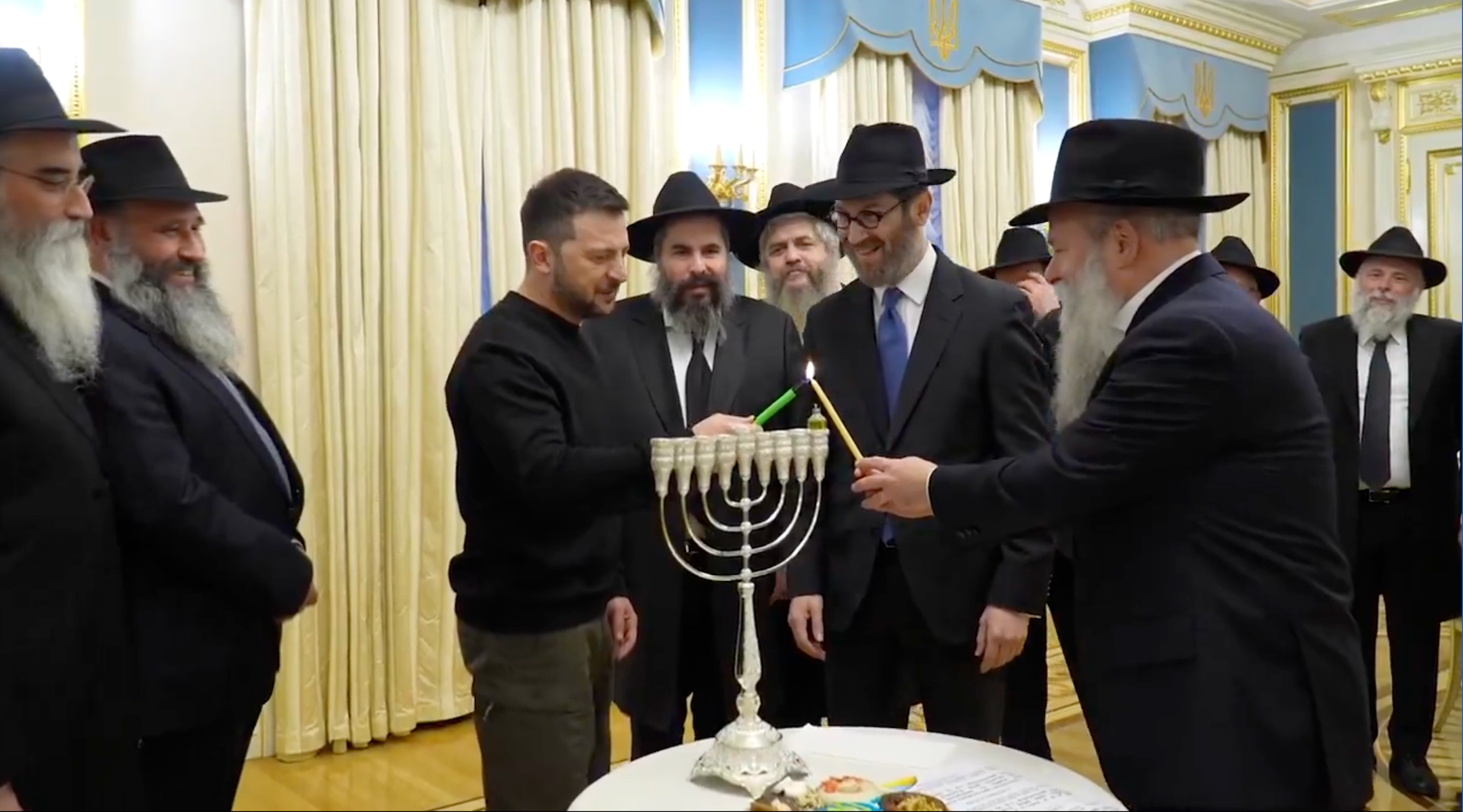 Ukraine’s Volodymyr Zelensky lights a Hanukkah menorah in Kyiv on Dec. 25, 2024. (Screenshot)